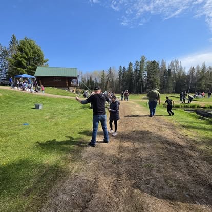 Supporters and residents gathered on the lawn during a His House of Hope community event